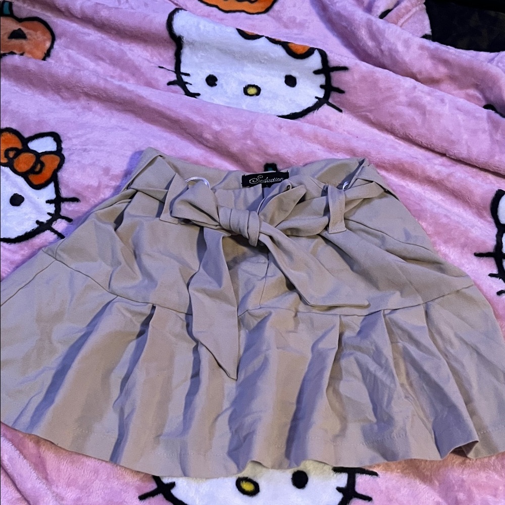 Seduction beige  mini skirt with bow belt size 3